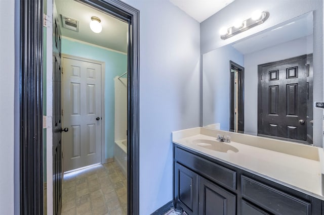 bathroom featuring vanity, shower / tub combination, and crown molding