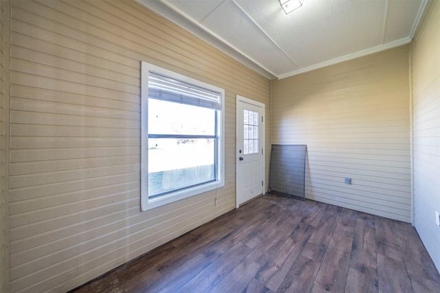 interior space featuring crown molding and dark hardwood / wood-style floors