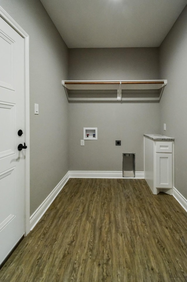 washroom featuring dark hardwood / wood-style floors, hookup for a washing machine, and electric dryer hookup