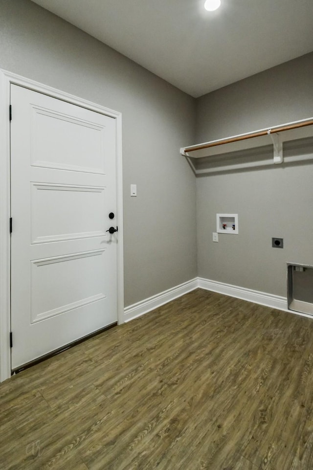 washroom with dark hardwood / wood-style flooring, hookup for a washing machine, and hookup for an electric dryer