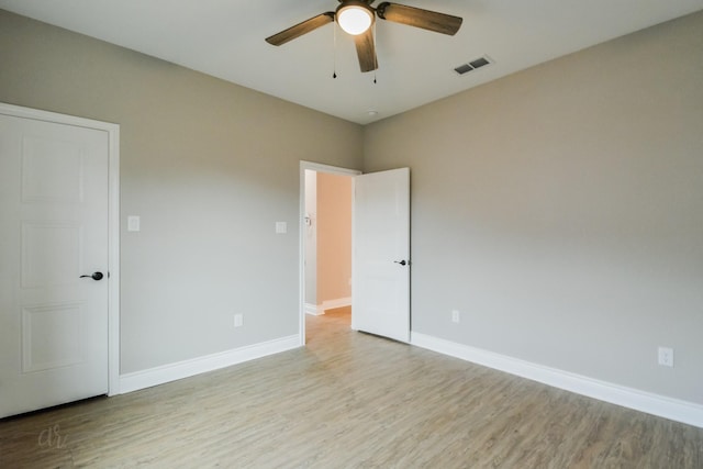 unfurnished room with ceiling fan and light hardwood / wood-style flooring