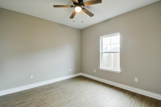 unfurnished room featuring hardwood / wood-style flooring and ceiling fan