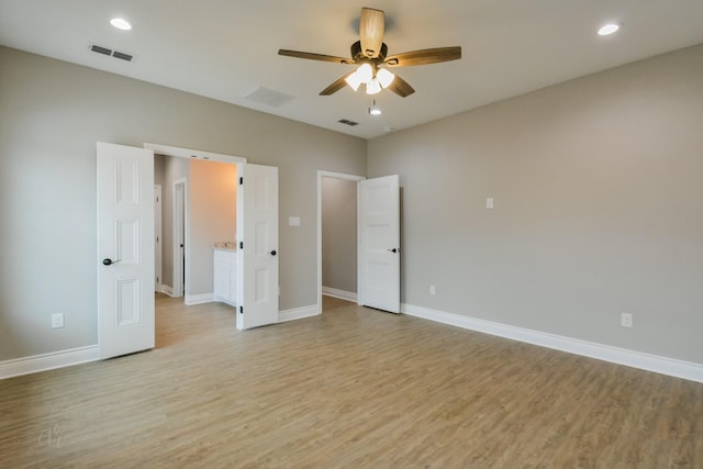 unfurnished bedroom with ceiling fan and light wood-type flooring