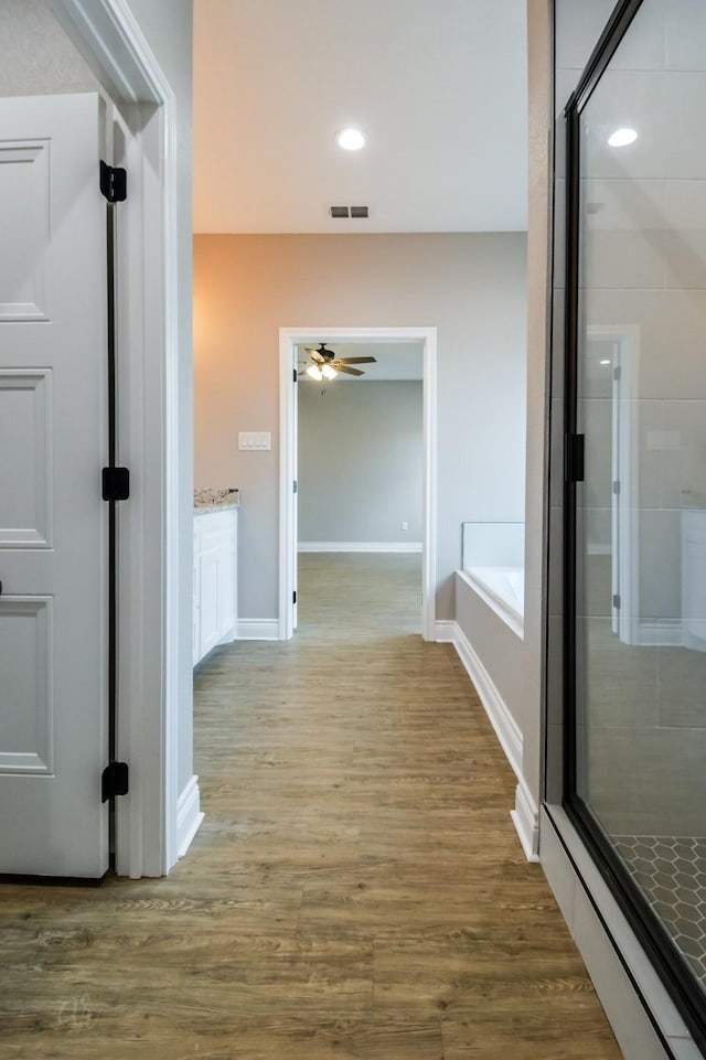 hallway featuring hardwood / wood-style floors