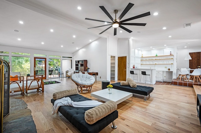 living room with ceiling fan, light hardwood / wood-style floors, and ornamental molding