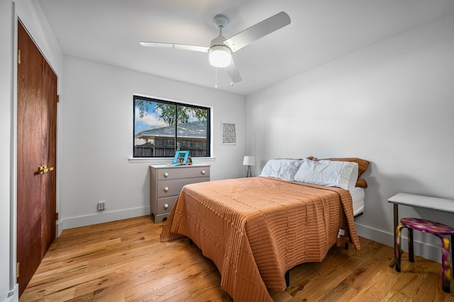 bedroom featuring light wood-type flooring and ceiling fan