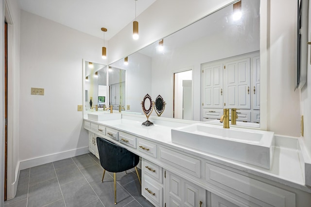 bathroom with tile patterned flooring and vanity