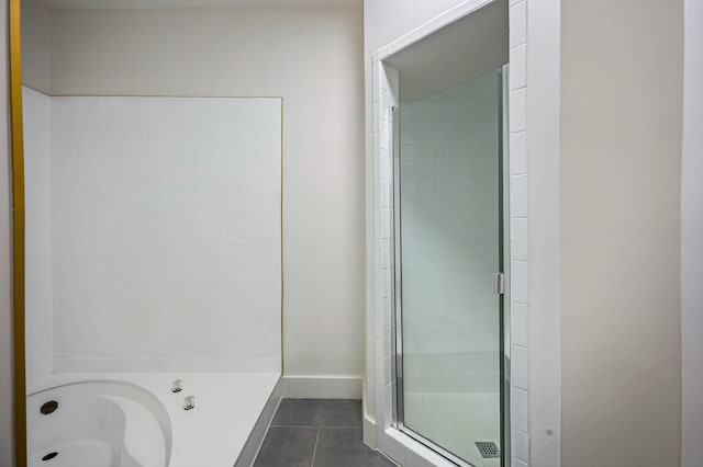 bathroom with tile patterned flooring and a shower with door