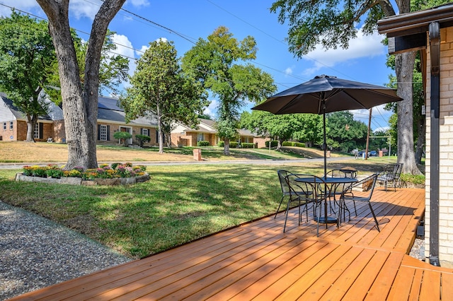 wooden deck with a yard