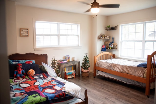 bedroom with hardwood / wood-style floors and ceiling fan