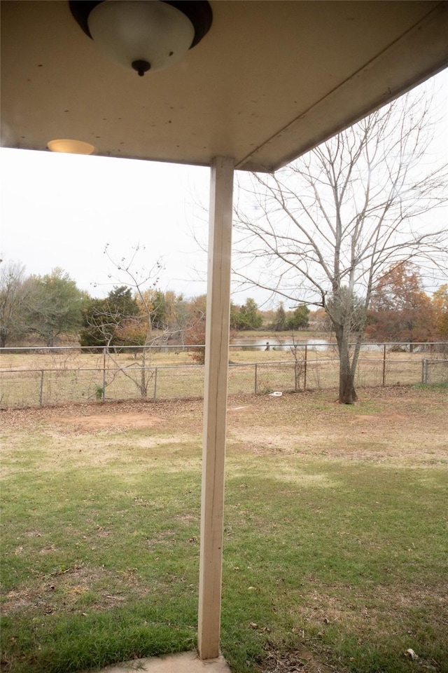 view of yard with a rural view