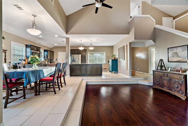 living room featuring ceiling fan and wood-type flooring