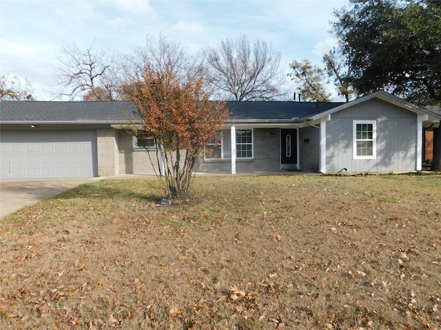 single story home featuring a garage and a front lawn