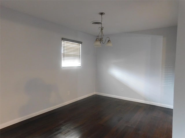 empty room featuring dark hardwood / wood-style flooring