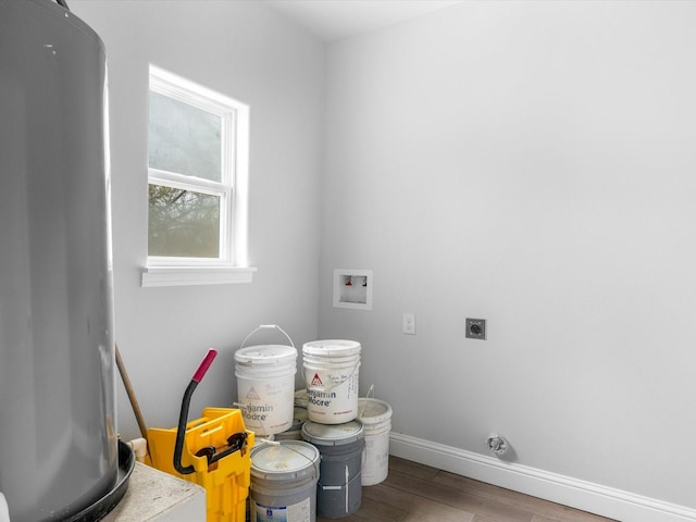 washroom with hardwood / wood-style floors, hookup for an electric dryer, water heater, and washer hookup