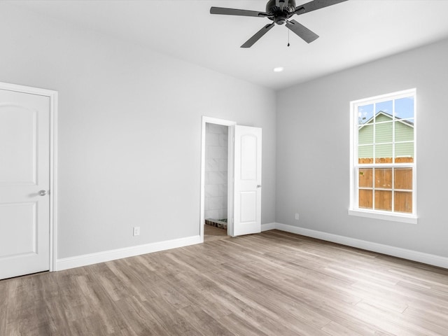 unfurnished bedroom featuring ceiling fan and light hardwood / wood-style floors