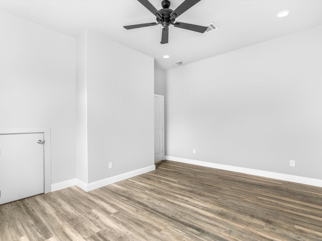 spare room with ceiling fan and hardwood / wood-style floors