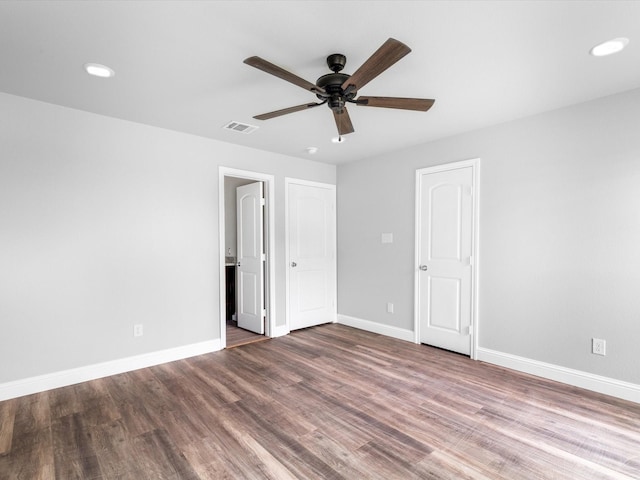 unfurnished bedroom featuring hardwood / wood-style flooring and ceiling fan