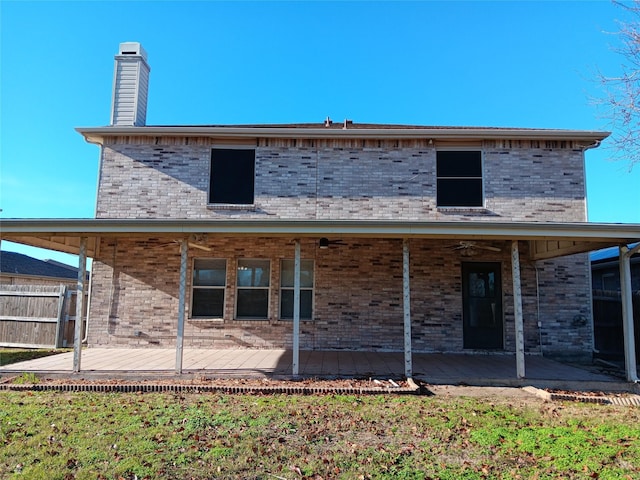 back of property featuring a wooden deck