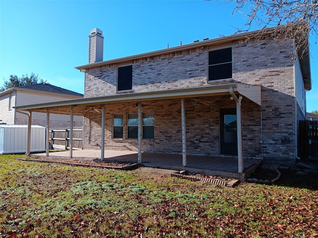 rear view of property featuring a patio area