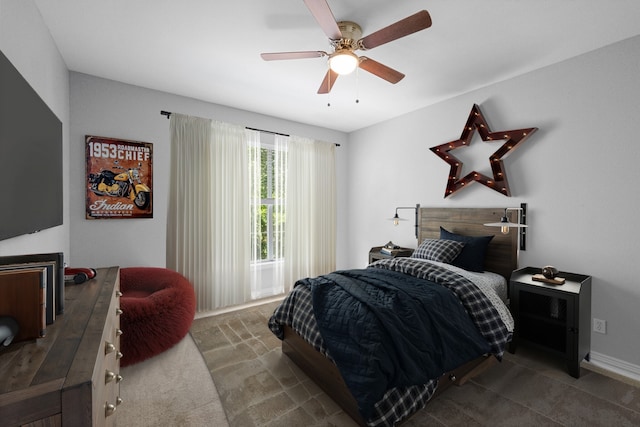 carpeted bedroom with a ceiling fan