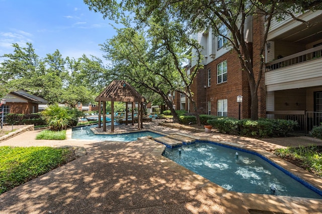 view of swimming pool featuring a gazebo