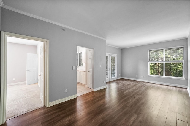 unfurnished living room featuring ornamental molding and light wood-type flooring