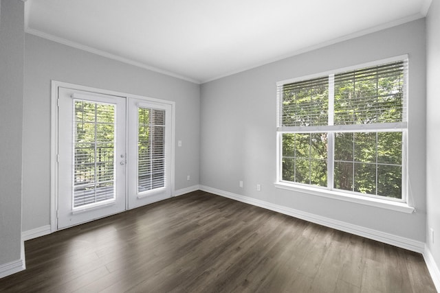 empty room featuring ornamental molding, french doors, baseboards, and dark wood-style flooring