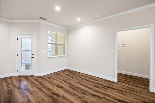 spare room with dark hardwood / wood-style floors and crown molding