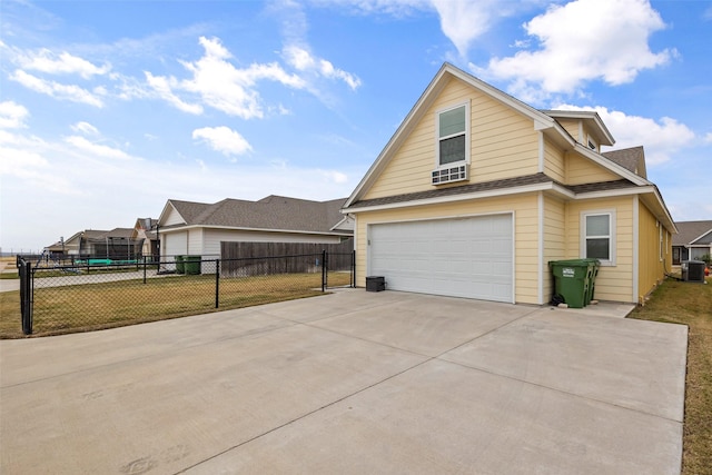 view of home's exterior with a lawn and central AC