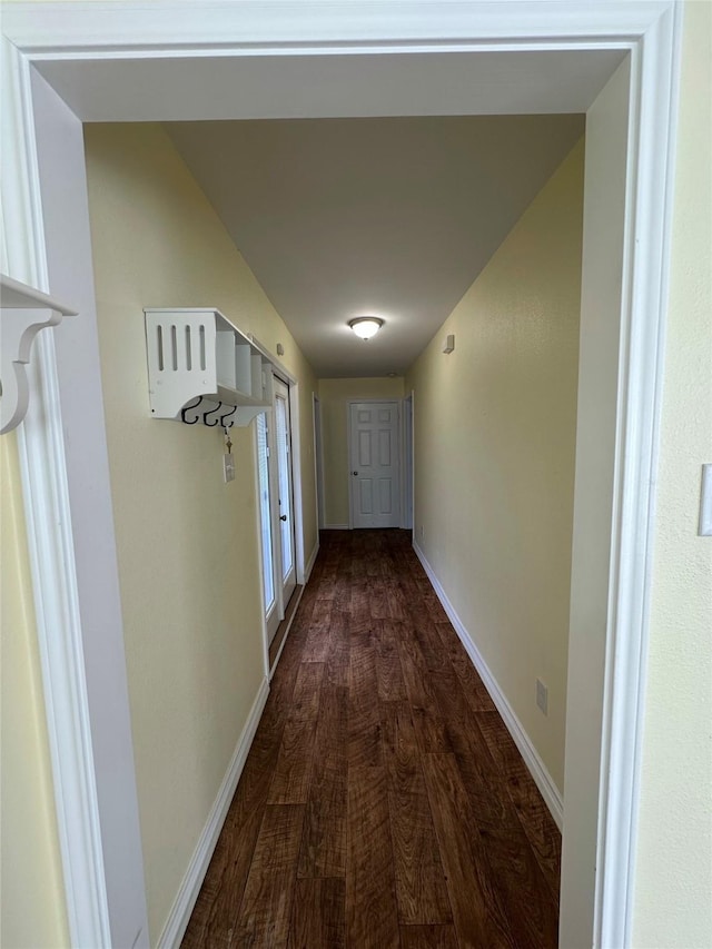 corridor featuring dark hardwood / wood-style flooring