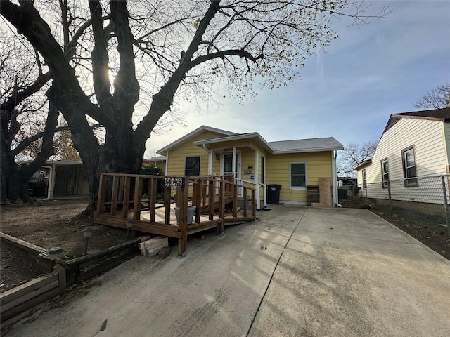 rear view of house with a wooden deck