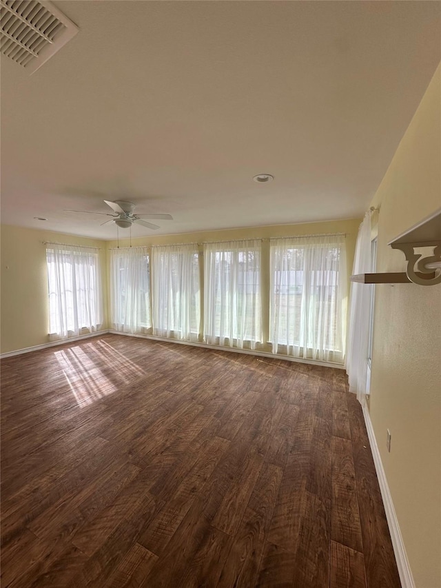 interior space featuring ceiling fan and dark hardwood / wood-style flooring