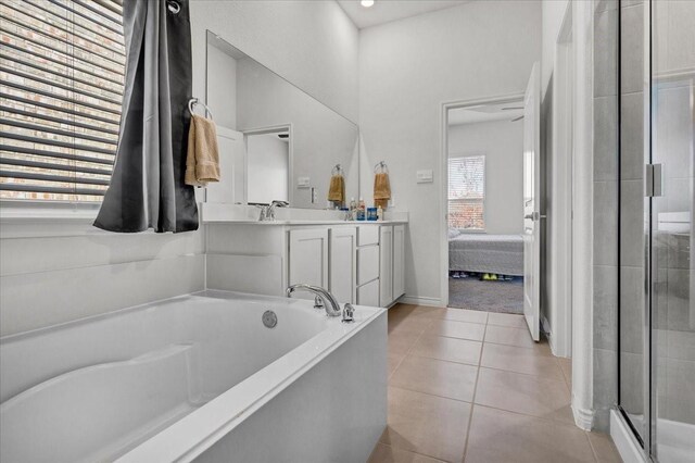 bathroom featuring vanity, tile patterned floors, and independent shower and bath