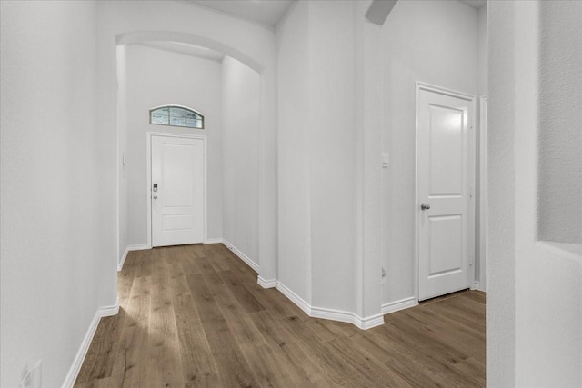 hall with hardwood / wood-style floors