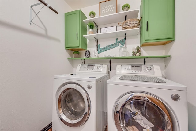 washroom featuring cabinets and independent washer and dryer