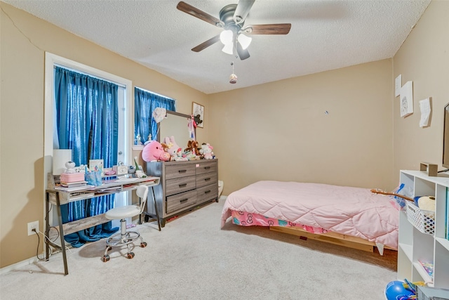 bedroom with carpet flooring, ceiling fan, and a textured ceiling