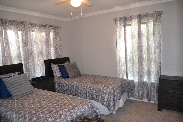 bedroom with ceiling fan, carpet floors, and crown molding