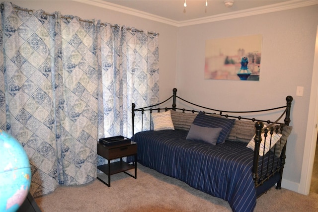 bedroom with carpet flooring and crown molding