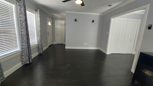 interior space featuring dark hardwood / wood-style floors, ceiling fan, and ornamental molding