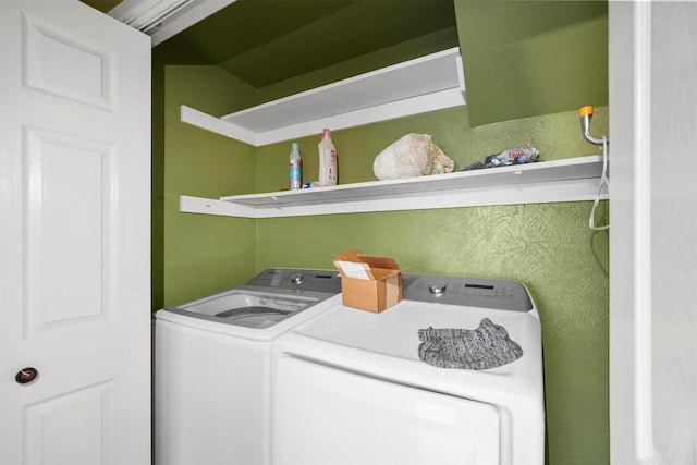 laundry area with washing machine and dryer