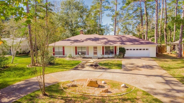 ranch-style home with a front yard, a porch, and a garage