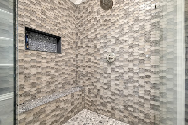 bathroom featuring tiled shower