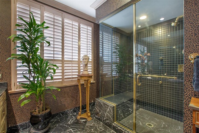 bathroom featuring a shower with door