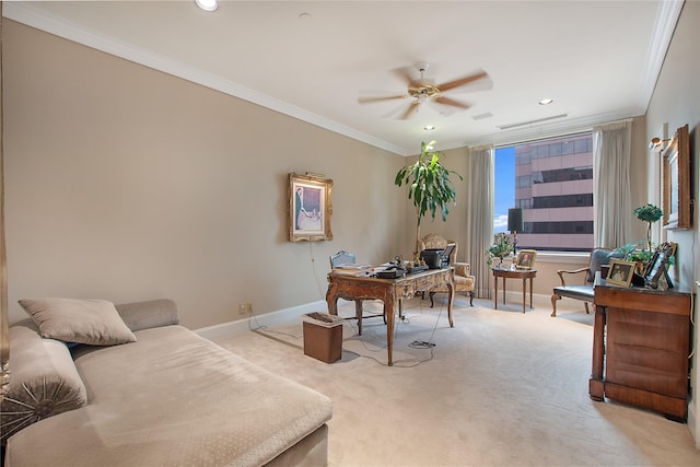 carpeted office with ornamental molding and ceiling fan