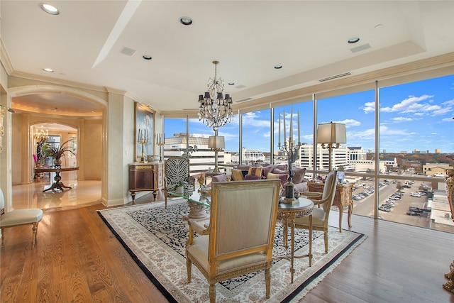 8181 Douglas Ave Unit 800, Dallas, TX 75225 - dining area featuring arched walkways, a chandelier, recessed lighting, wood finished floors, and expansive windows