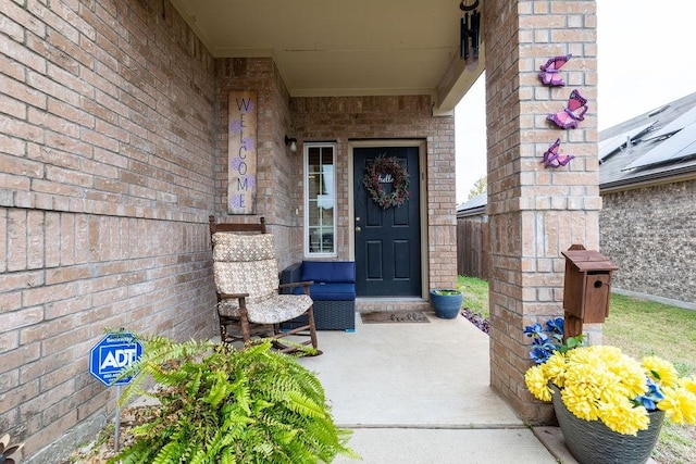 doorway to property featuring covered porch