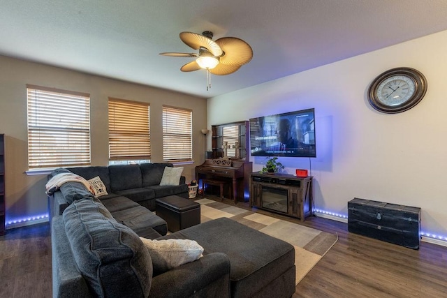 living room featuring hardwood / wood-style floors, plenty of natural light, and ceiling fan