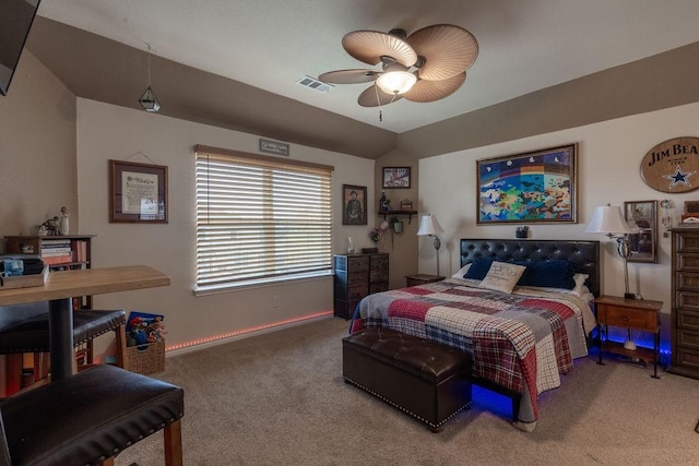 carpeted bedroom with ceiling fan and lofted ceiling