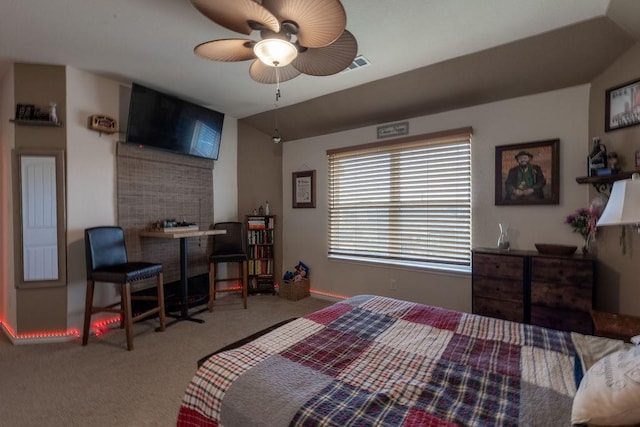 bedroom featuring ceiling fan, carpet floors, and lofted ceiling